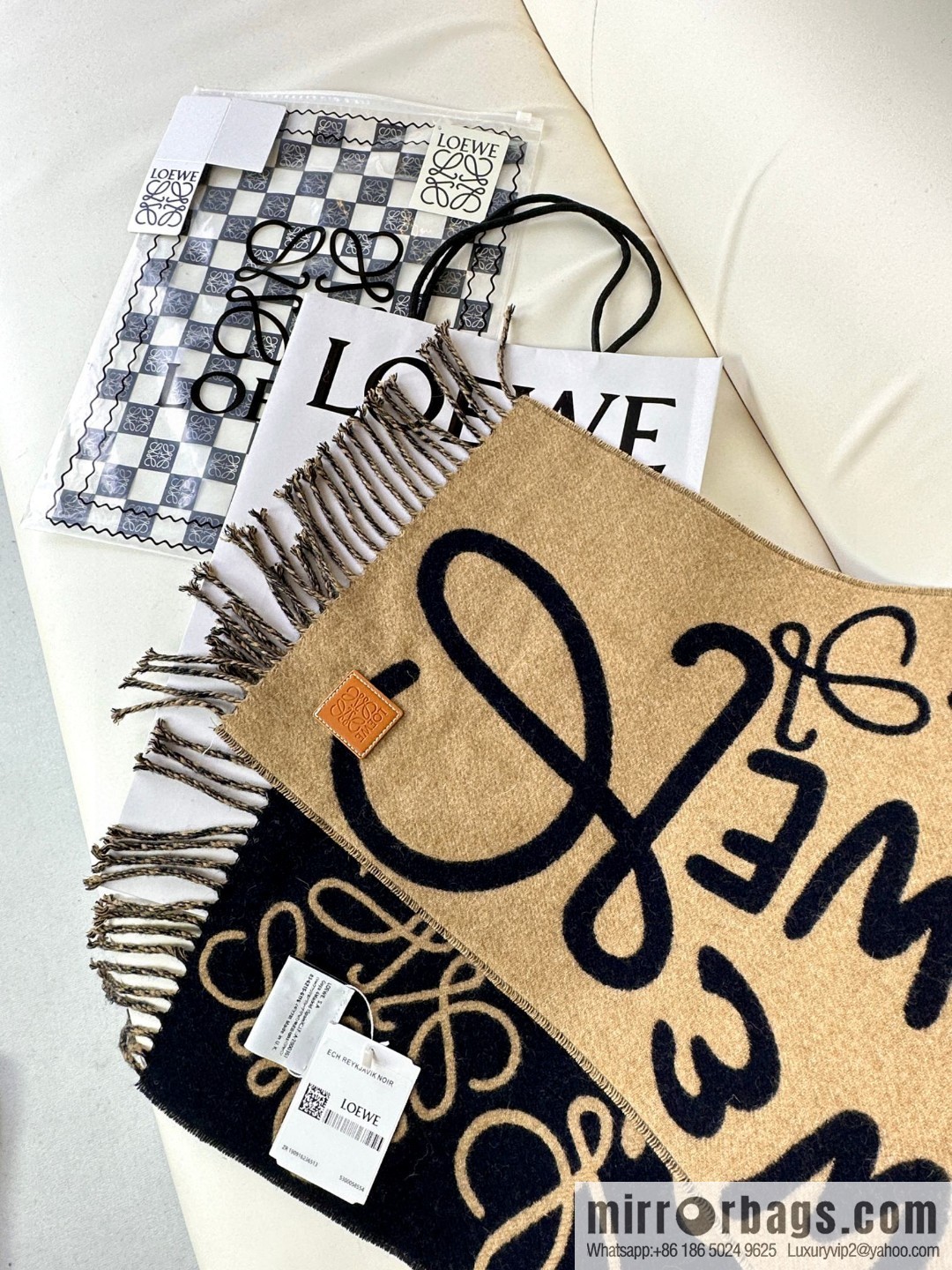 LOEWE decorated with Anagram pattern, graffiti scarf