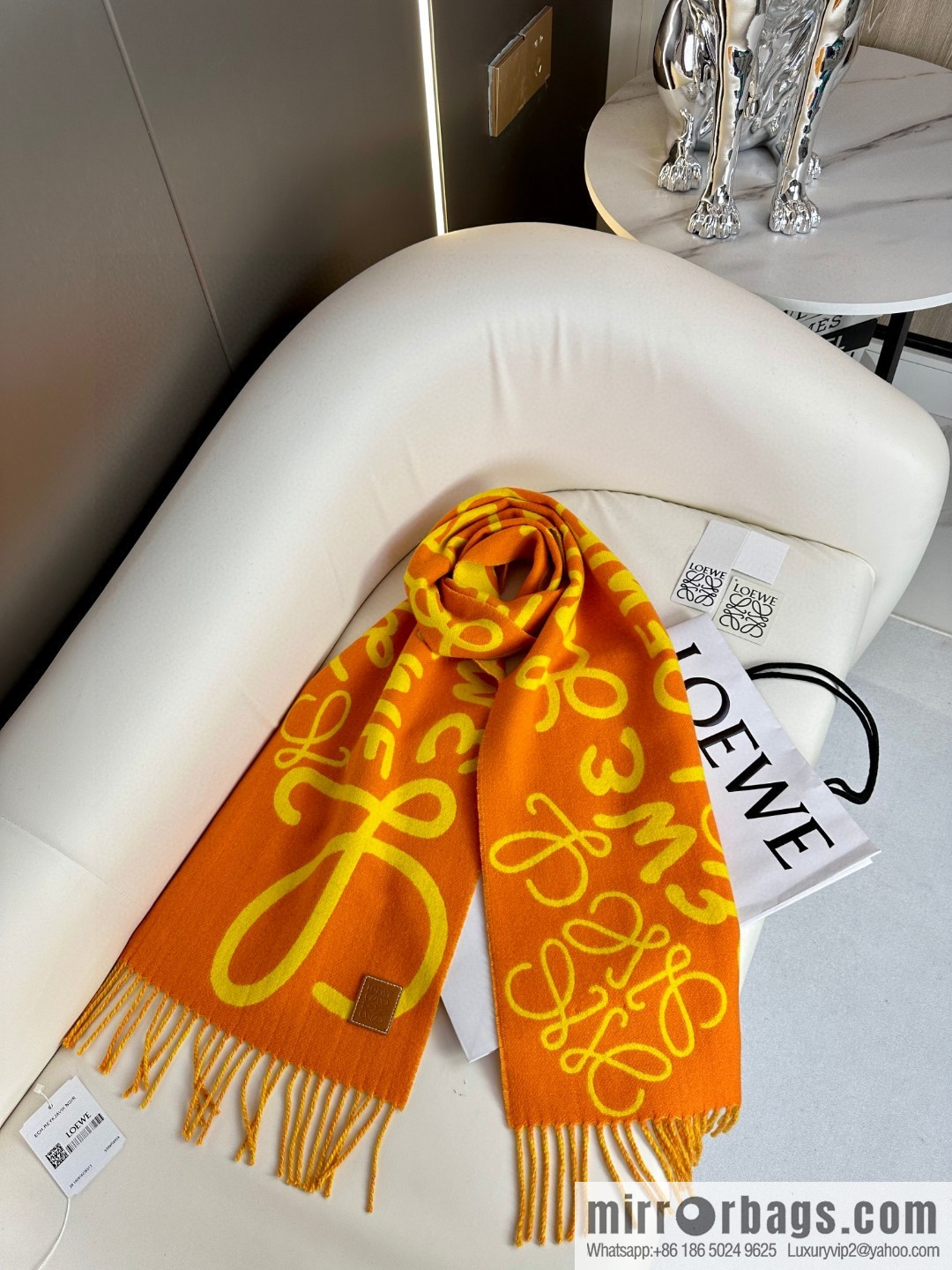 LOEWE decorated with Anagram pattern, graffiti scarf