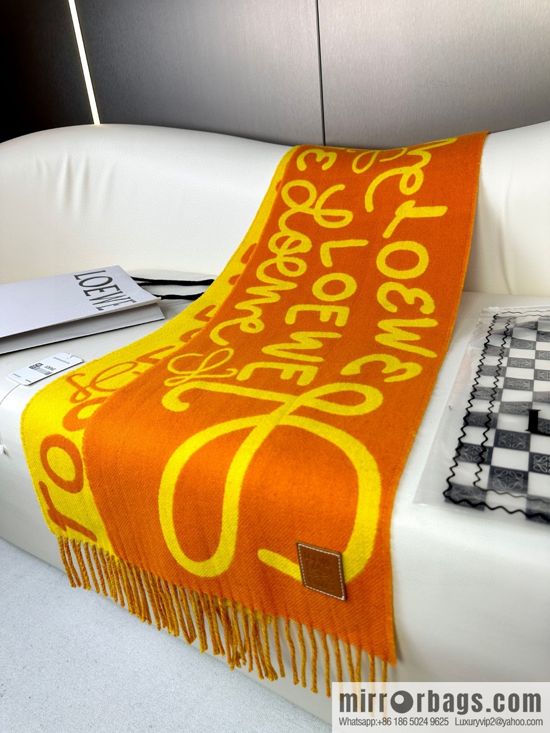LOEWE decorated with Anagram pattern, graffiti scarf