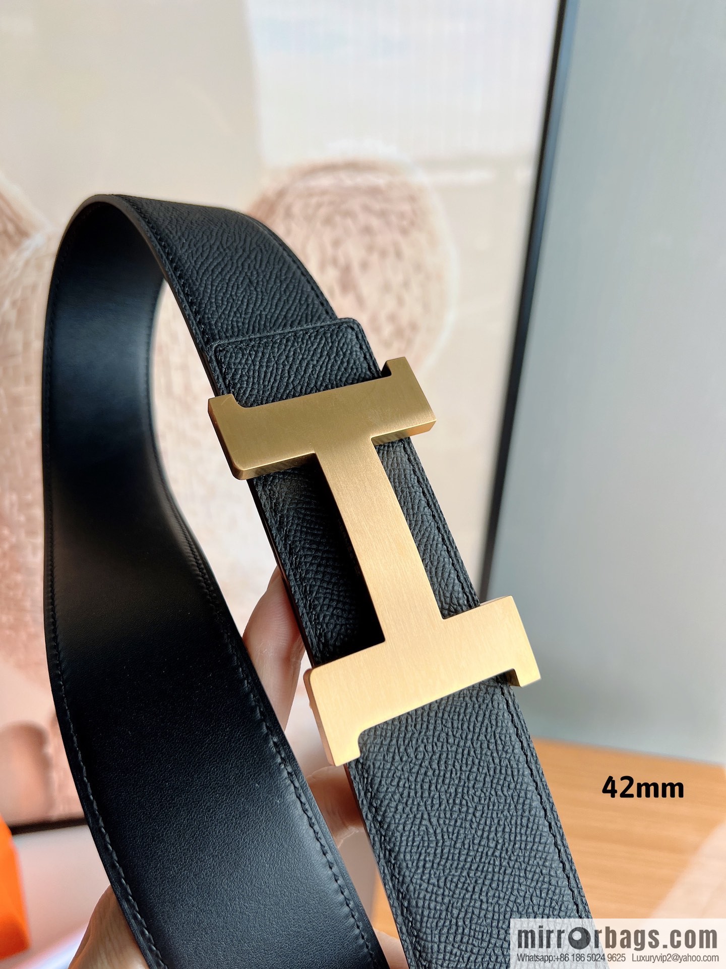 HERMES, Seiko crafted black cowhide belt with 42mm iconic elements
