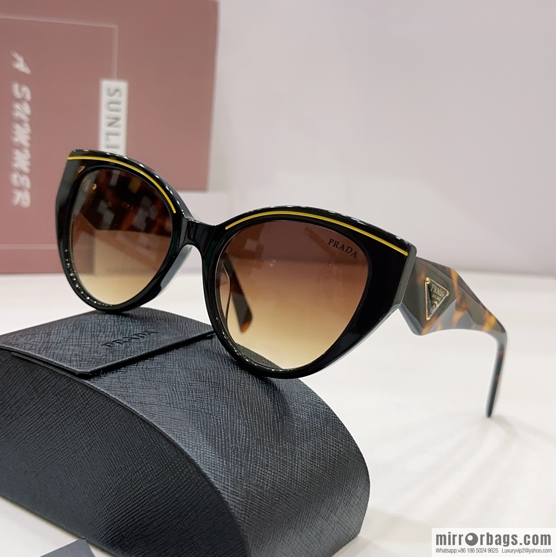 Prada round frame women's sunglasses