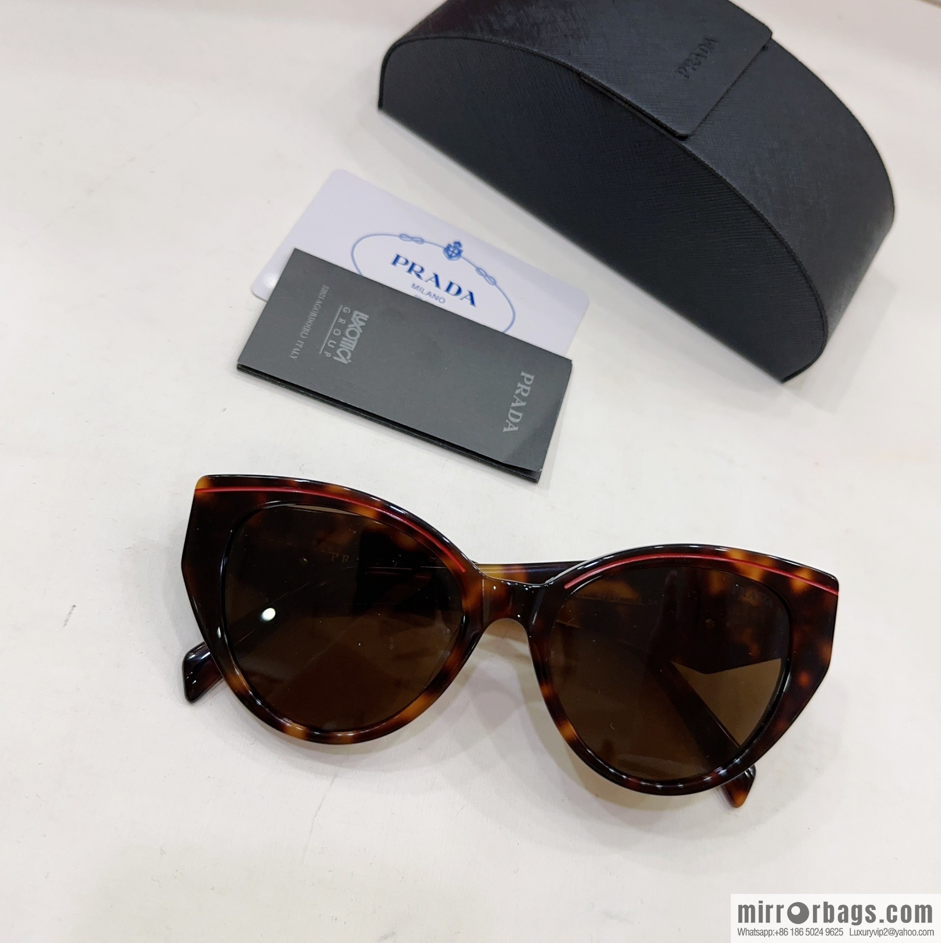 Prada round frame women's sunglasses