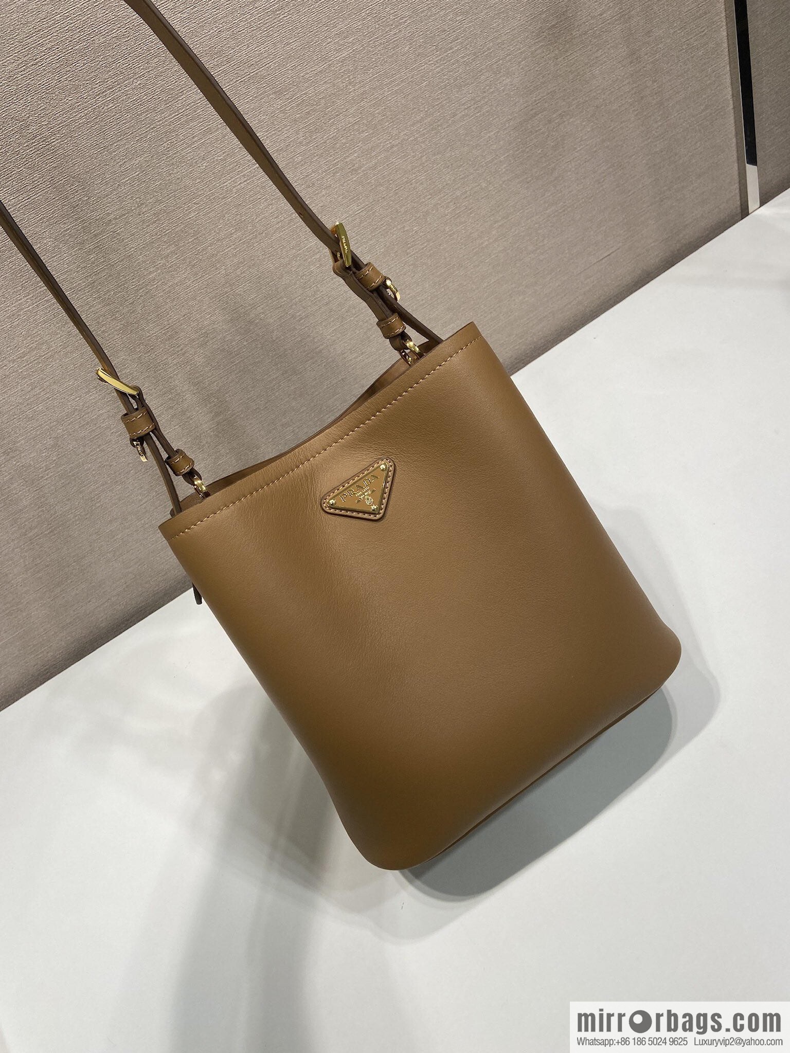 PRADA's new 1BE080 bucket bag, caramel color