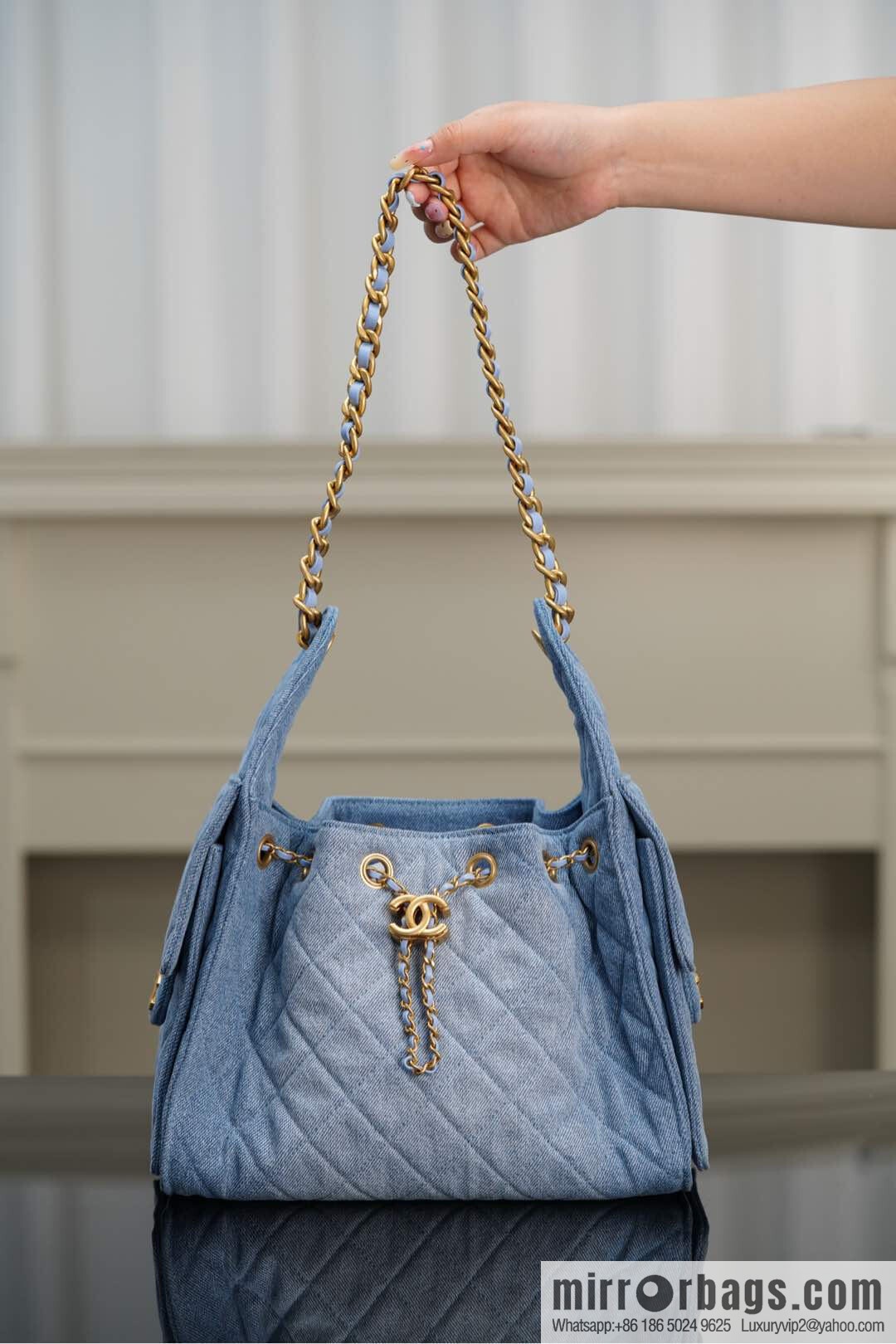 ππ‘ππ§ππ₯ πππ¬ π¬π¦ππ₯π₯ π‘π¨ππ¨ Drawstring Bucket Bag, Denim Blue π Small AS5293