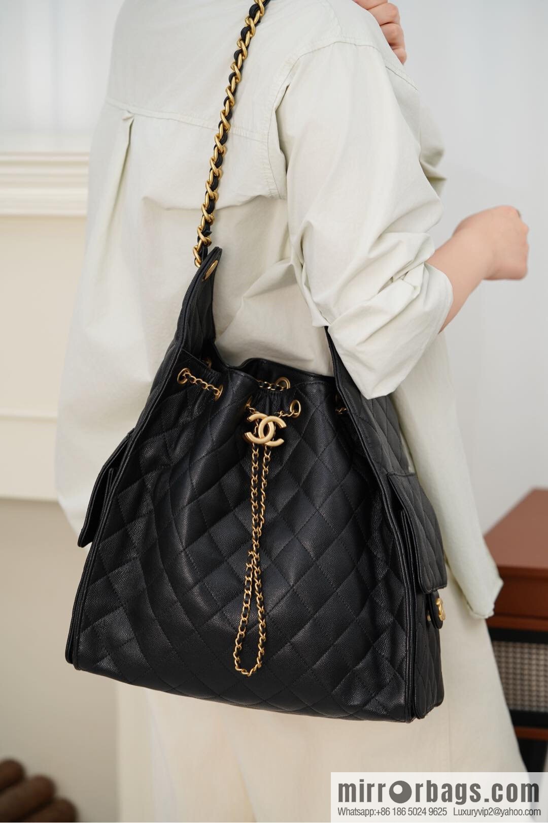 ππ‘ππ§ππ₯ πππ¬ π‘π¨ππ¨ πππ Drawstring Bucket Bag, Black Gold Caviar, Large βοΈ AS5311