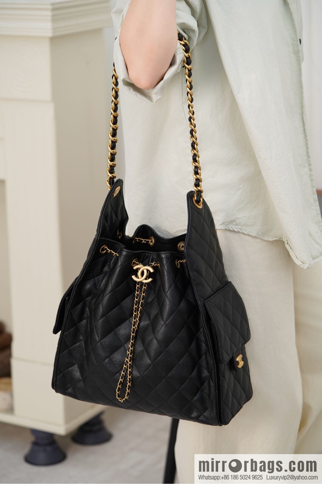 ππ‘ππ§ππ₯ πππ¬ π‘π¨ππ¨ πππ Drawstring Bucket Bag, Black Gold Caviar, Large βοΈ AS5311