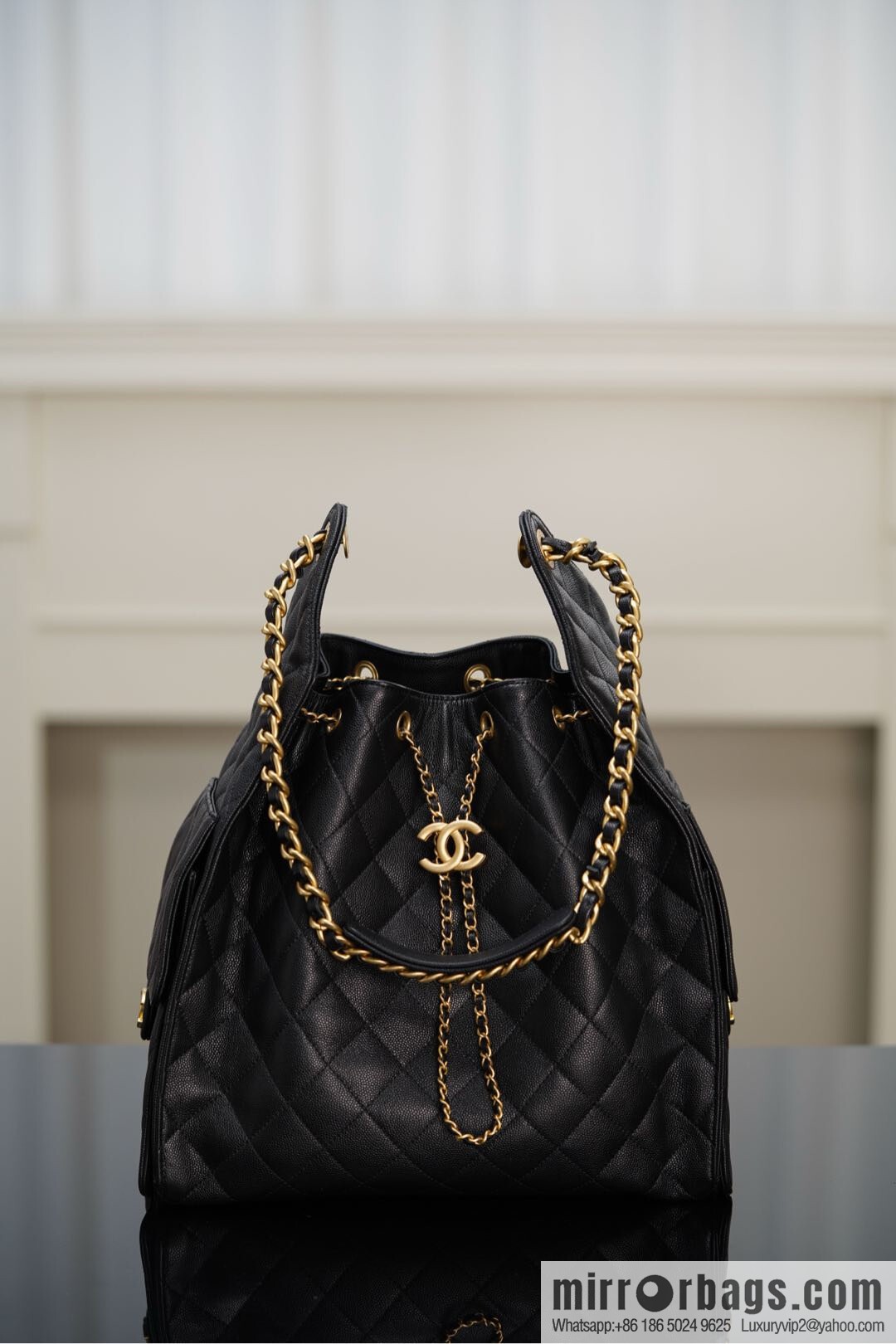 ππ‘ππ§ππ₯ πππ¬ π‘π¨ππ¨ πππ Drawstring Bucket Bag, Black Gold Caviar, Large βοΈ AS5311