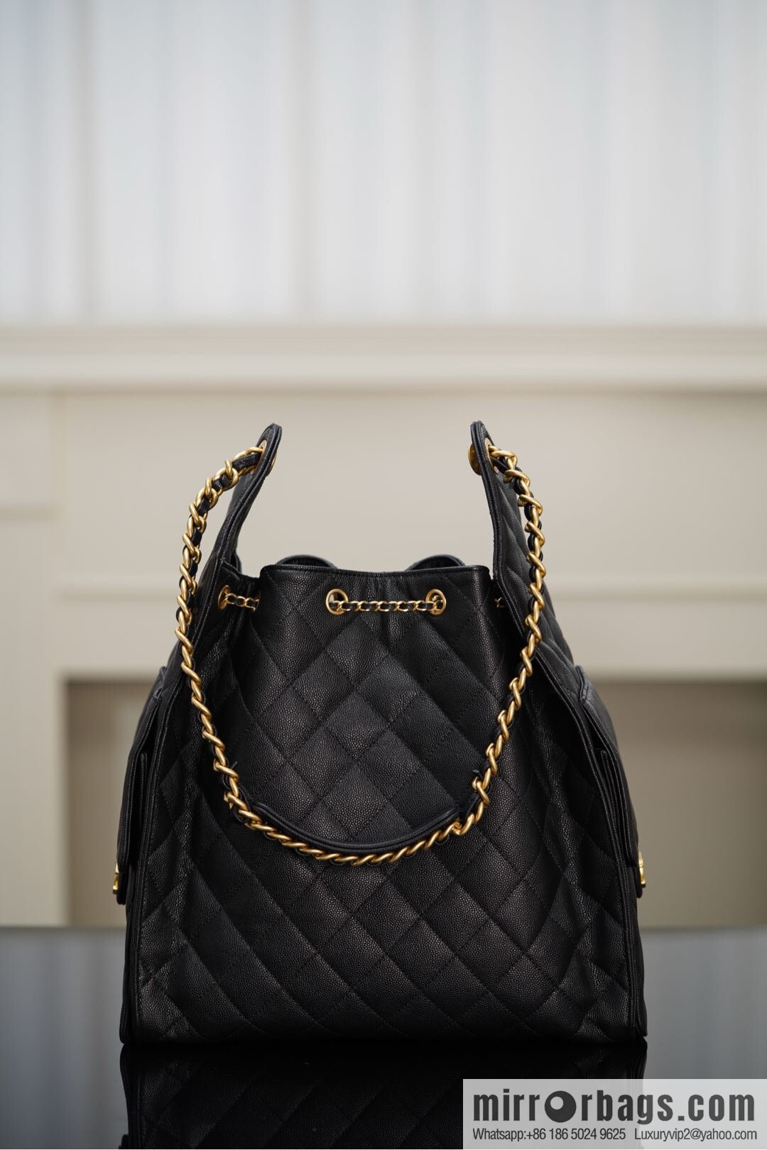 ππ‘ππ§ππ₯ πππ¬ π‘π¨ππ¨ πππ Drawstring Bucket Bag, Black Gold Caviar, Large βοΈ AS5311