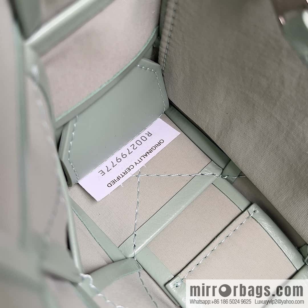 Highest end: Bottega Veneta Cassette/Pillow Bag Model: 667298 Sage Green