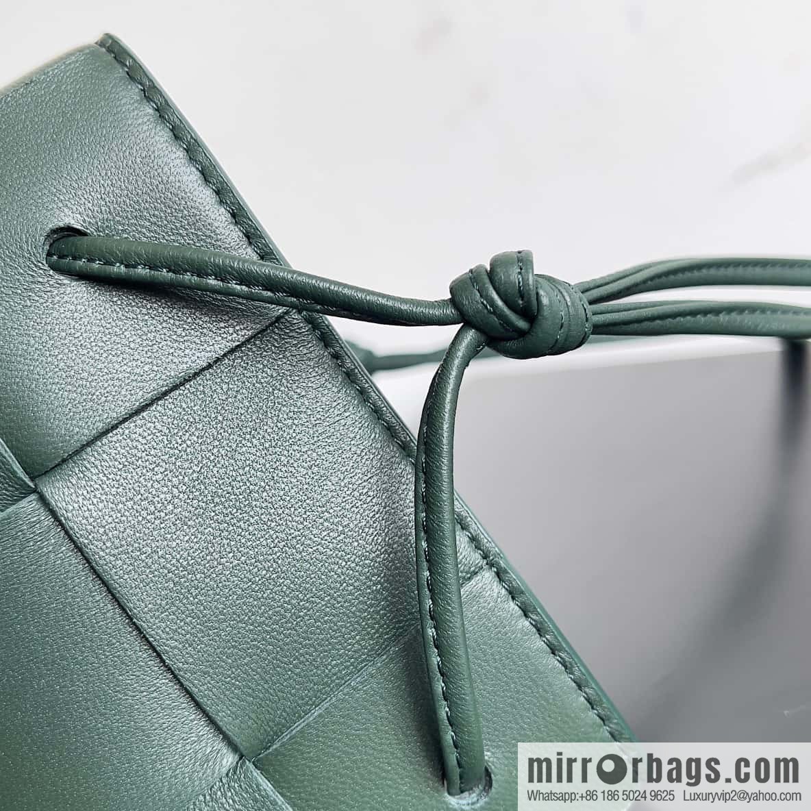 BottegaVeneta Bv small bucket bag pleated leather woven bucket bag model number: 680218 rain tree green