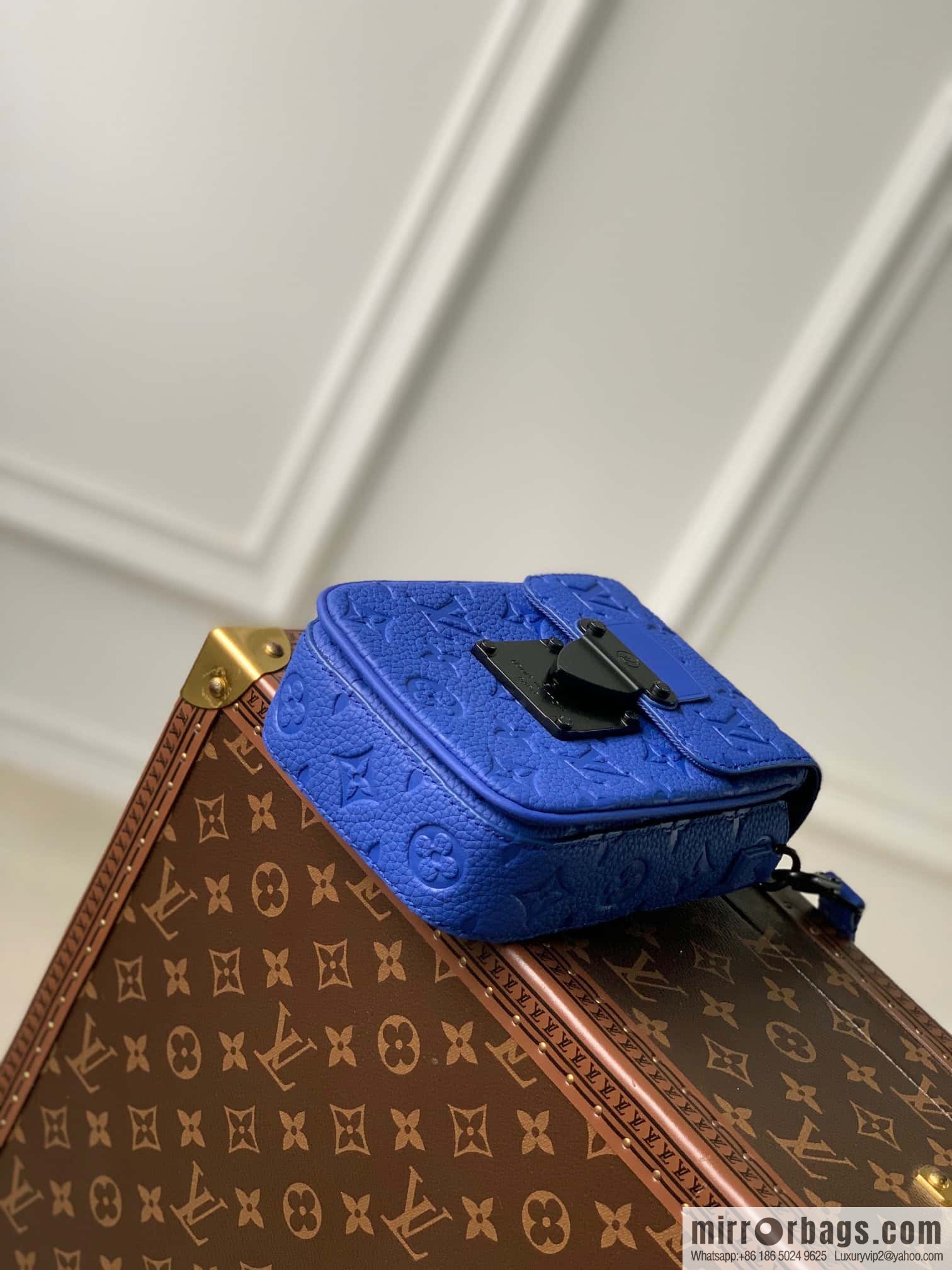 M82568 Blue S-Lock Vertical mini handbag