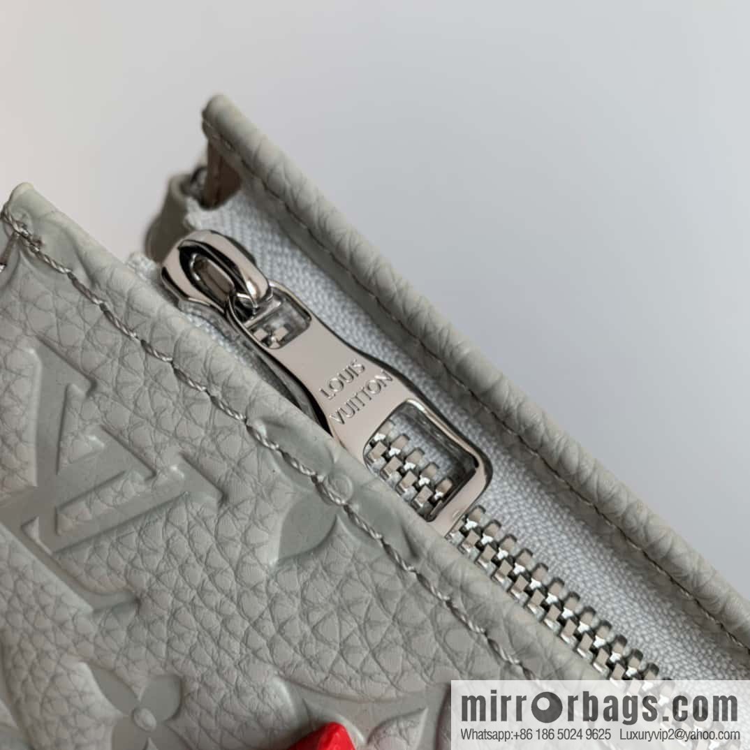 M81556 White clutch bag 1934 Louis Vuitton Sac Tricot handbag