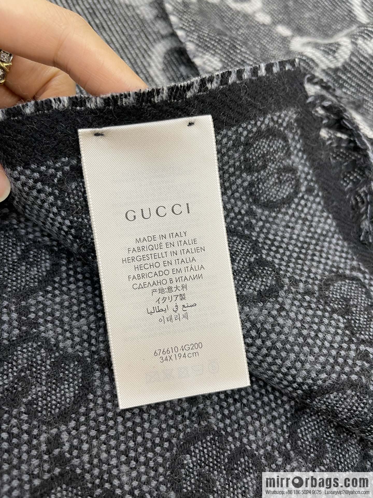 GUCCI Gucci GG pattern double-sided wool scarf 676610