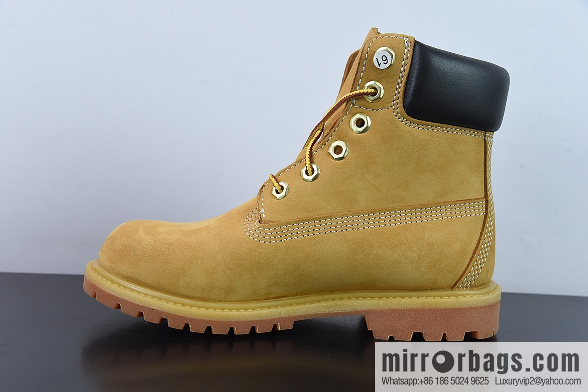 Timberland classic big yellow boots, seven-hole men's size 10061, six-hole women's size 10361.