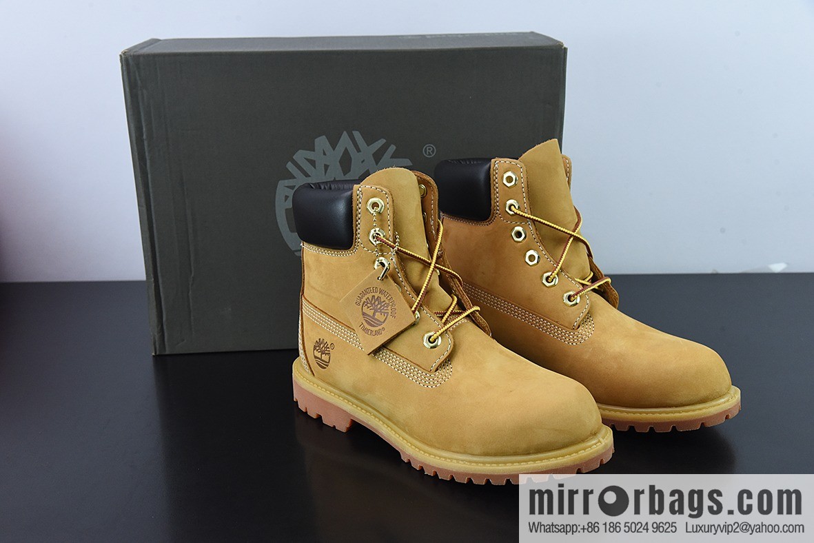 Timberland classic big yellow boots, seven-hole men's size 10061, six-hole women's size 10361.