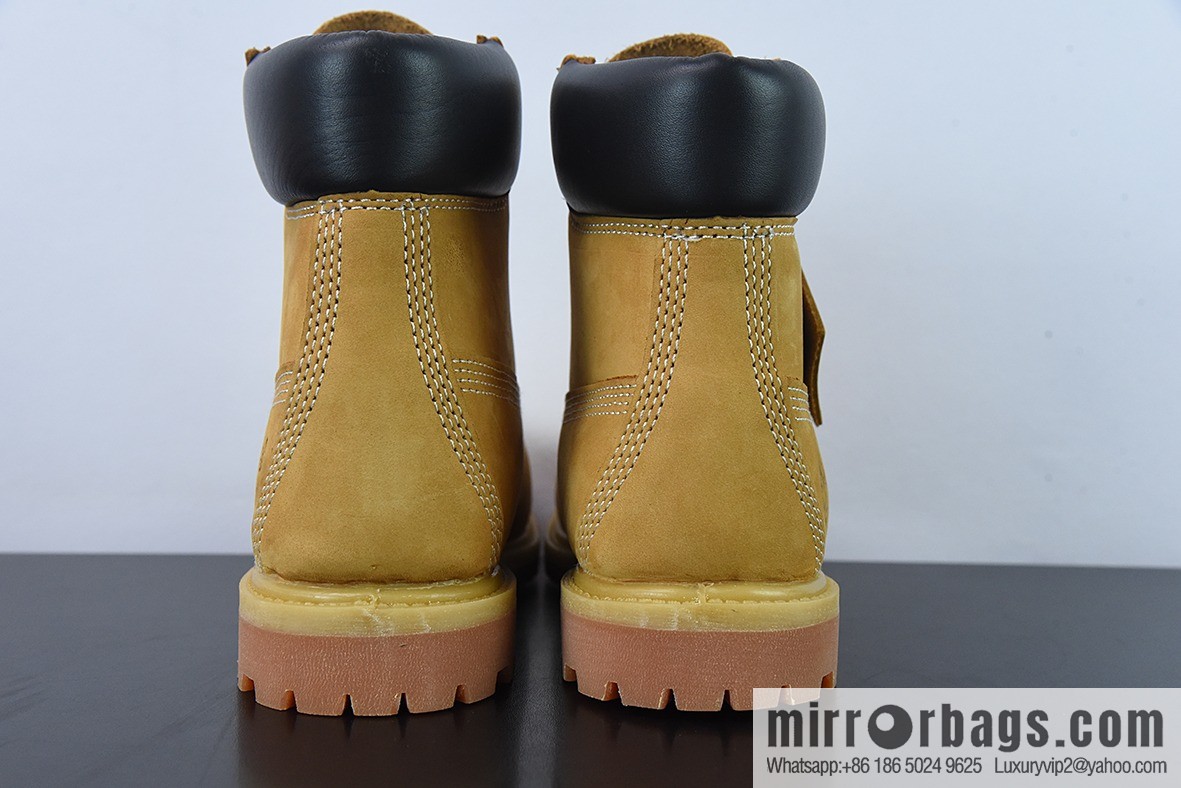 Timberland classic big yellow boots, seven-hole men's size 10061, six-hole women's size 10361.