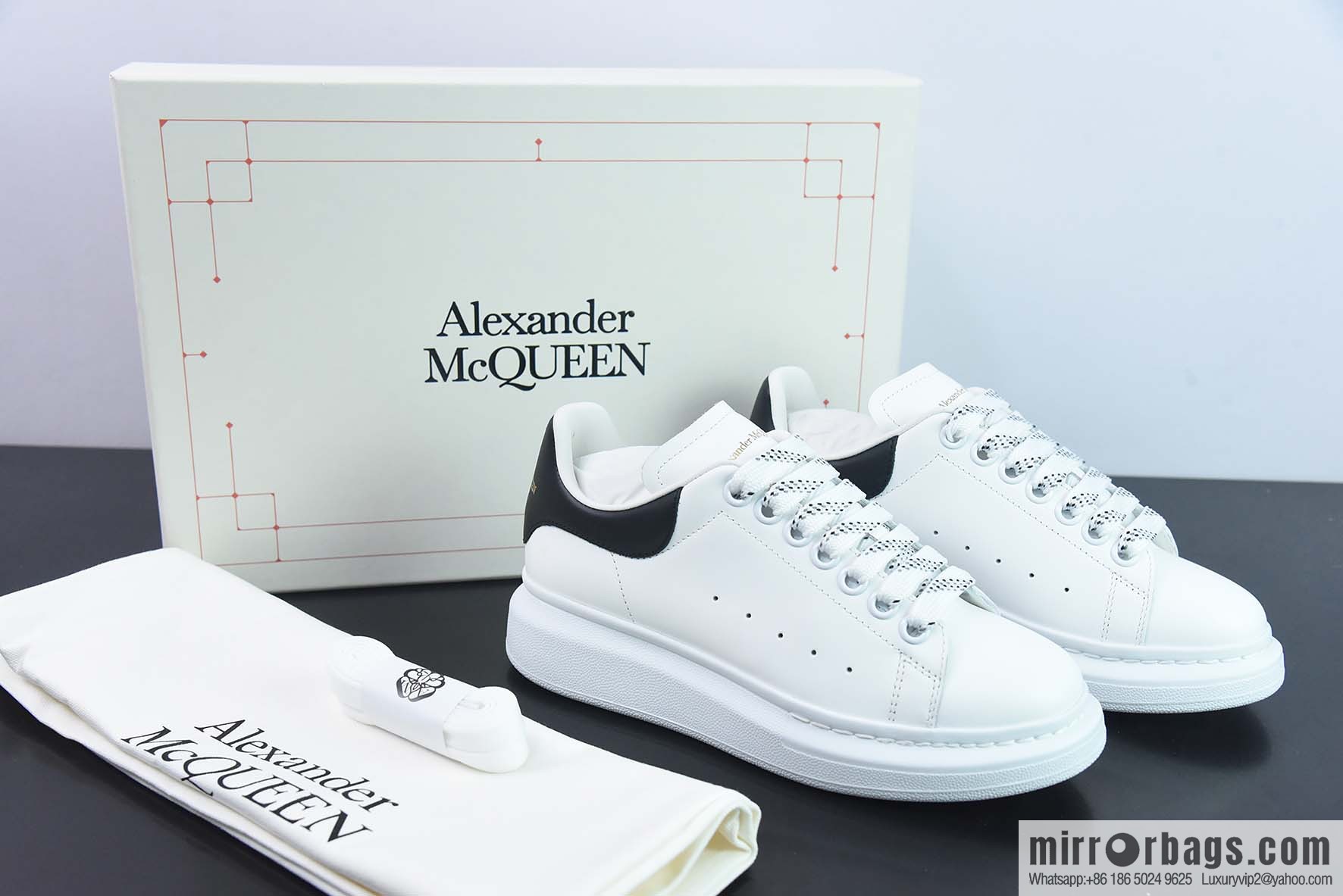 Alexander McQueen, black shiny low-top sneakers
