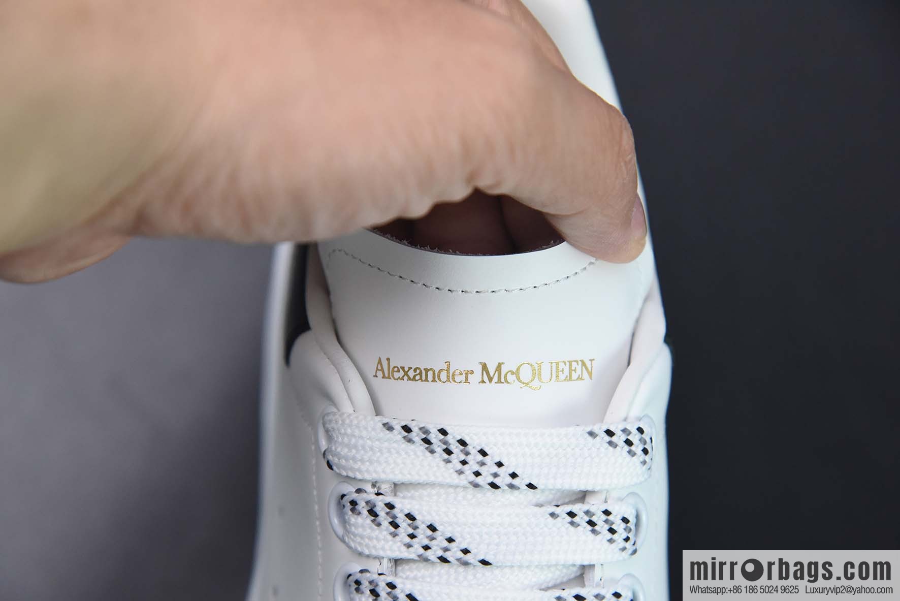 Alexander McQueen, black shiny low-top sneakers