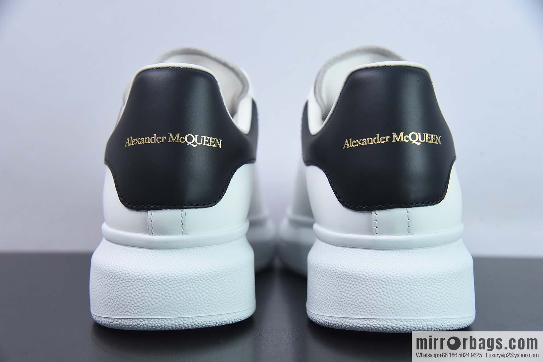 Alexander McQueen, black shiny low-top sneakers