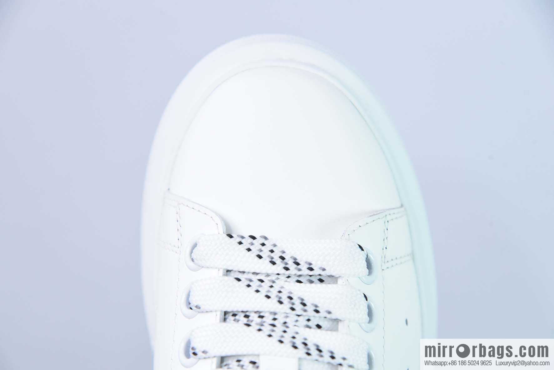 Alexander McQueen, black shiny low-top sneakers