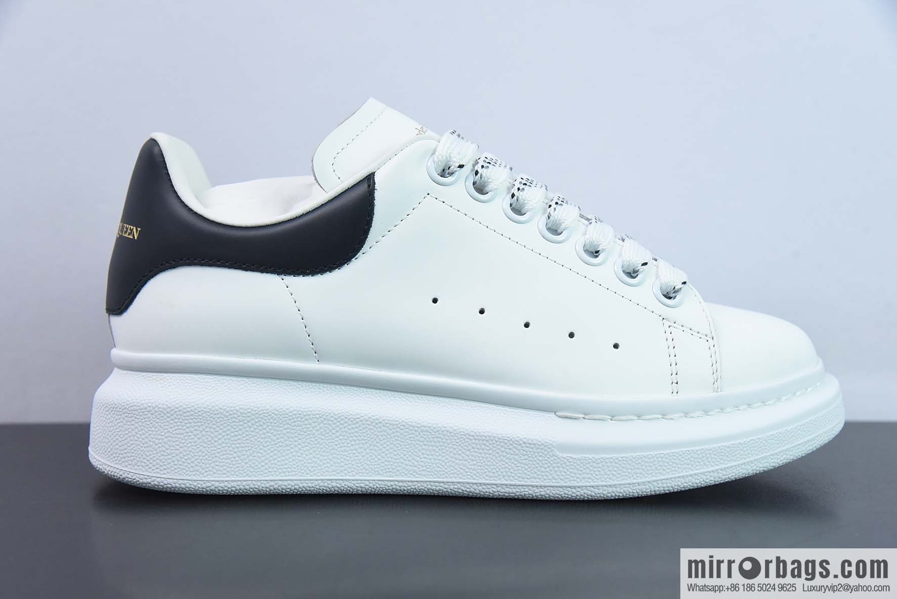 Alexander McQueen, black shiny low-top sneakers