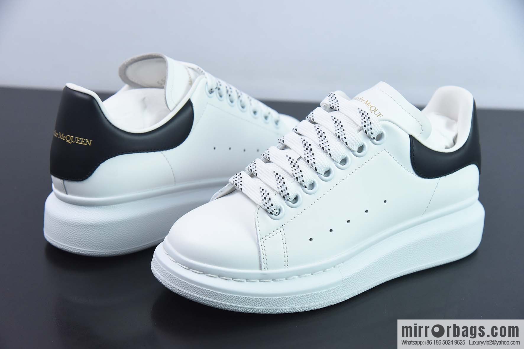 Alexander McQueen, black shiny low-top sneakers