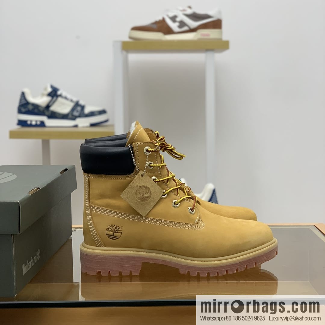 Timberland's beige frosted leather with white stitching and side stamping His & Hers boots