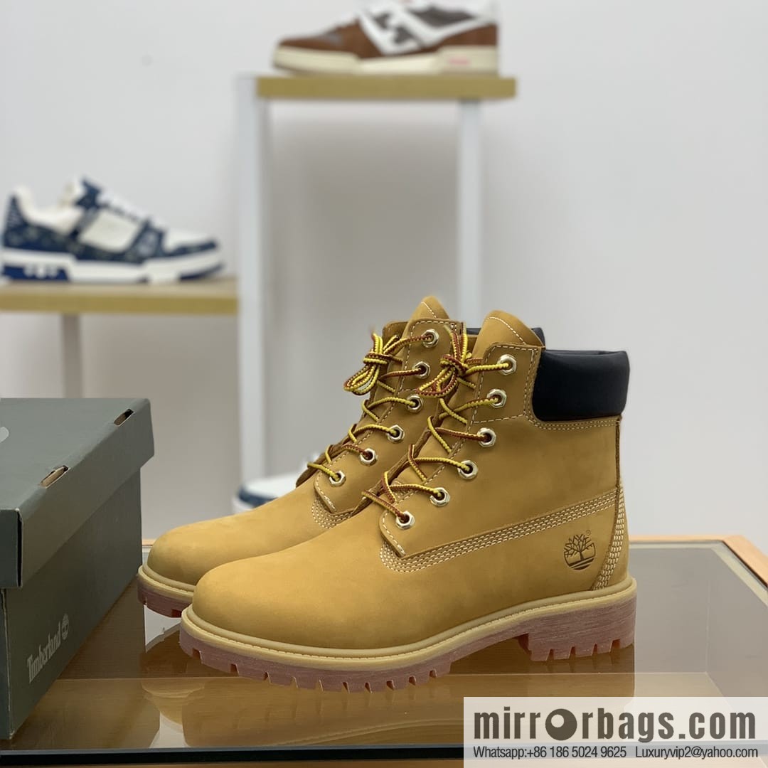 Timberland's beige frosted leather with white stitching and side stamping His & Hers boots