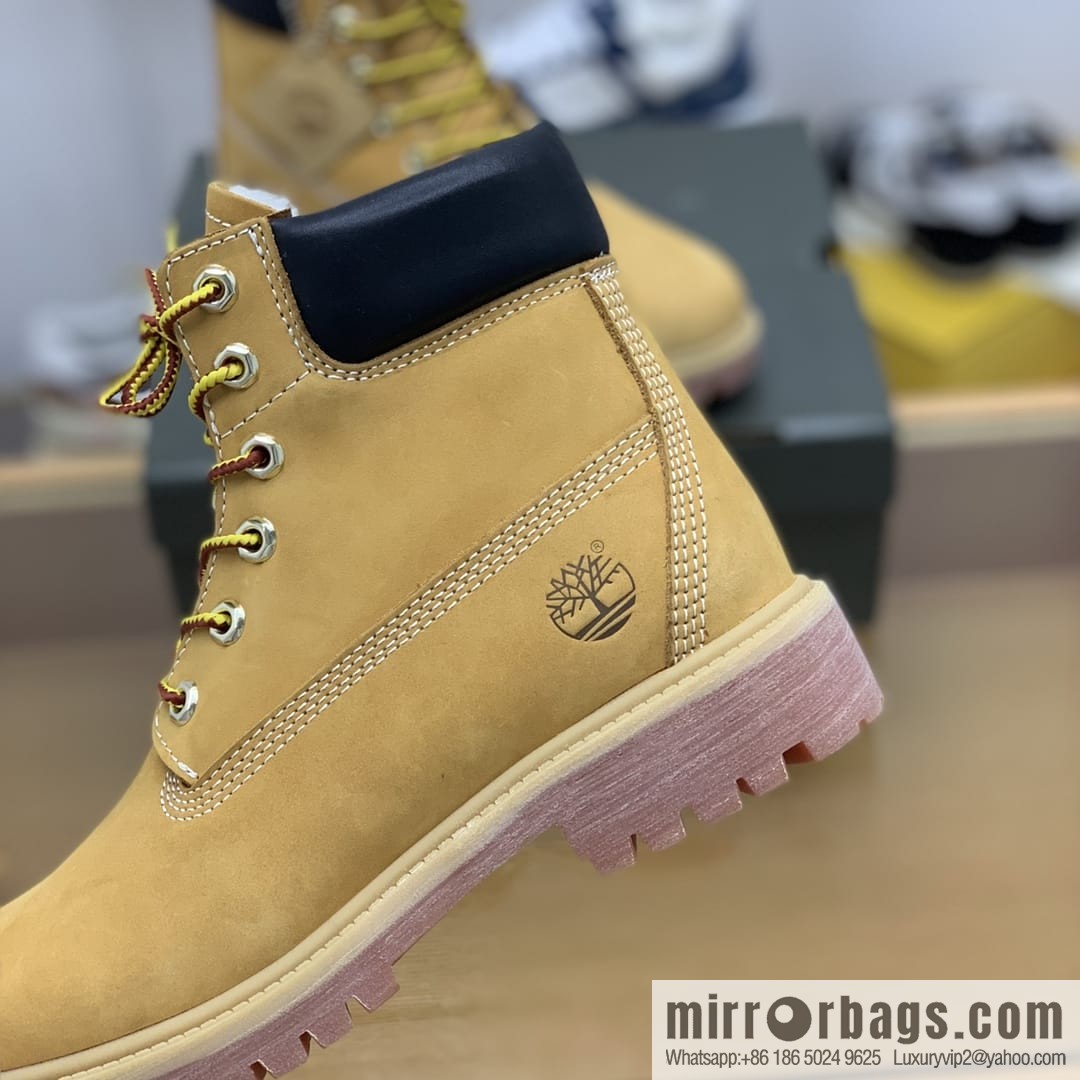 Timberland's beige frosted leather with white stitching and side stamping His & Hers boots