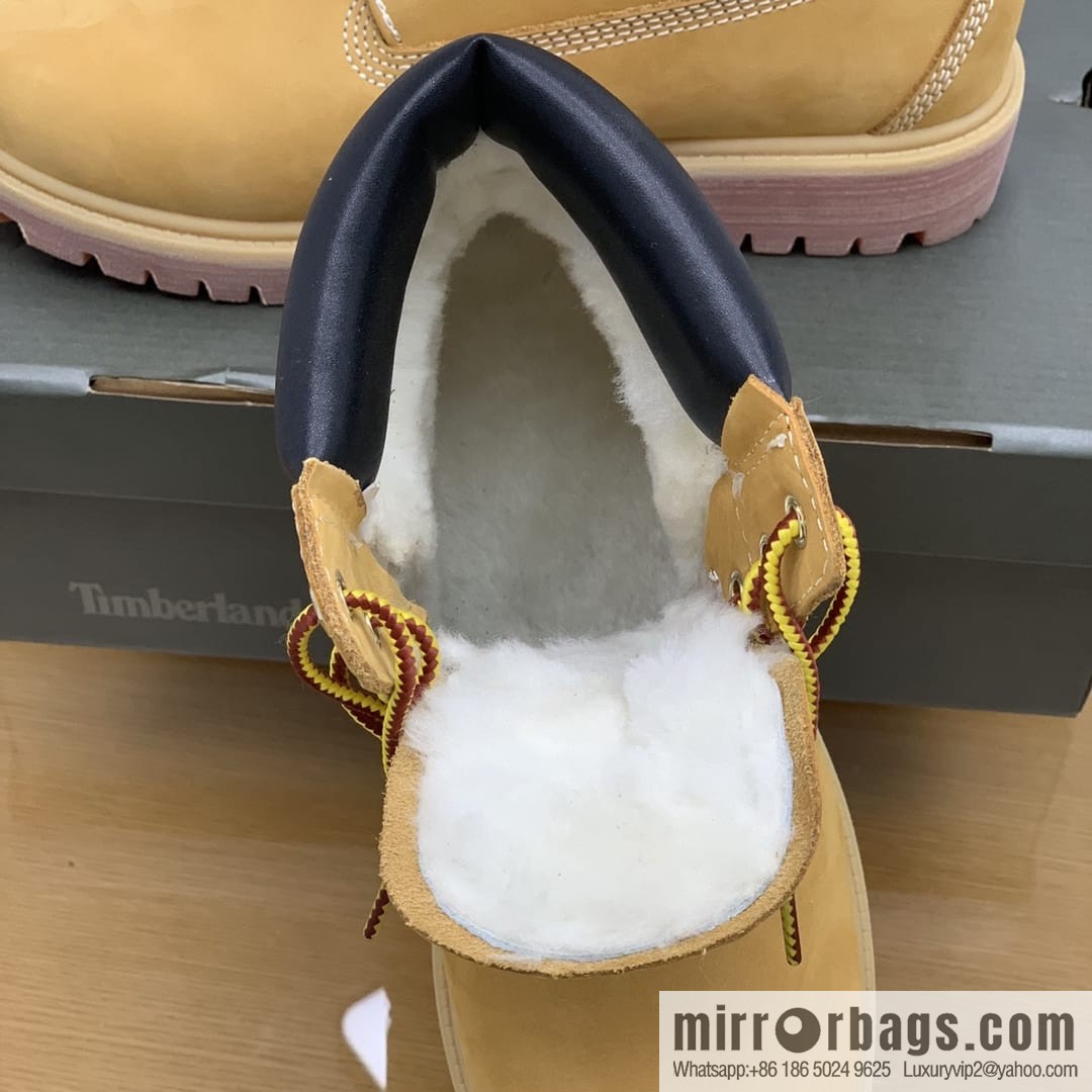 Timberland's beige frosted leather with white stitching and side stamping His & Hers boots