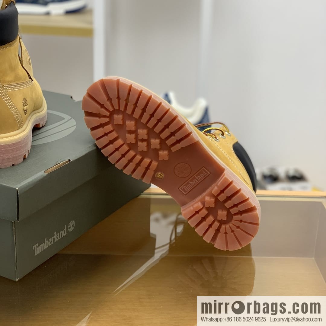 Timberland's beige frosted leather with white stitching and side stamping His & Hers boots