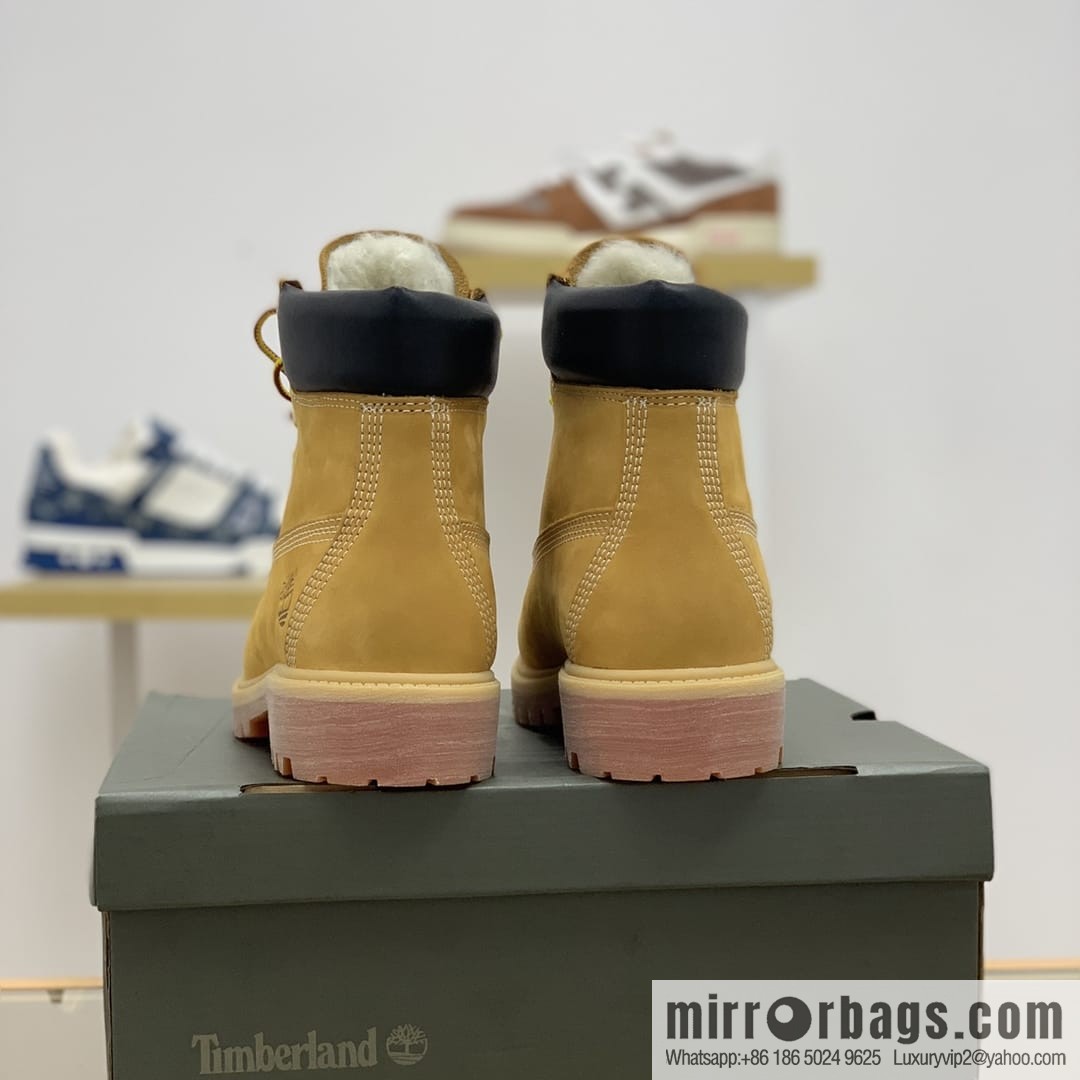 Timberland's beige frosted leather with white stitching and side stamping His & Hers boots