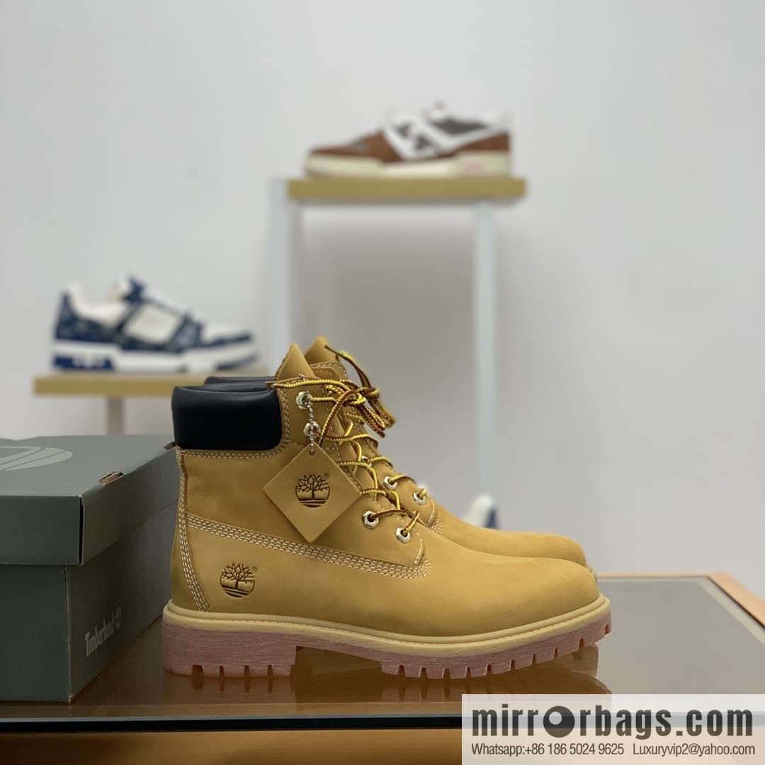 Timberland's beige frosted leather with white stitching and side stamping His & Hers boots