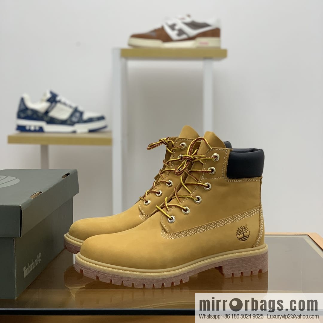 Timberland's beige frosted leather with white stitching and side stamping His & Hers boots