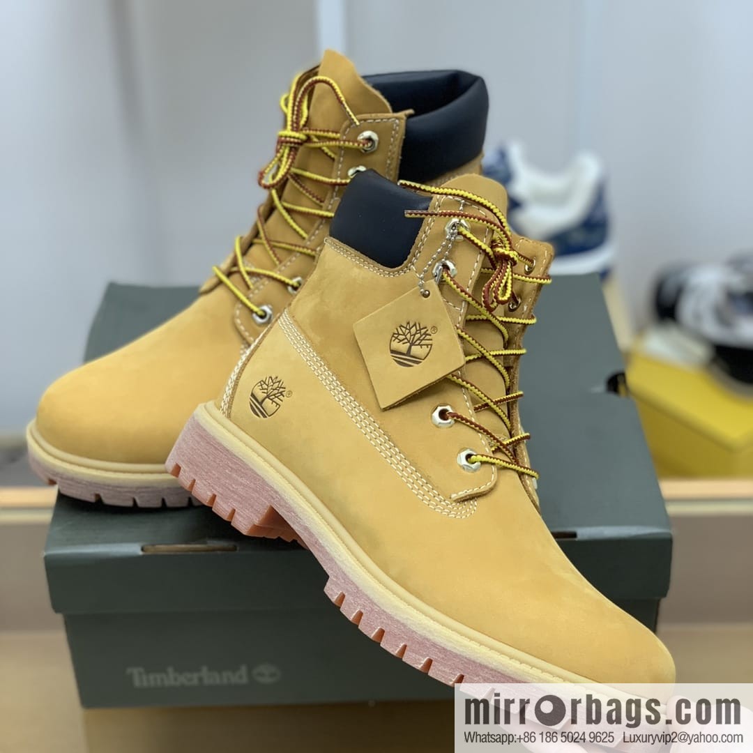 Timberland's beige frosted leather with white stitching and side stamping His & Hers boots