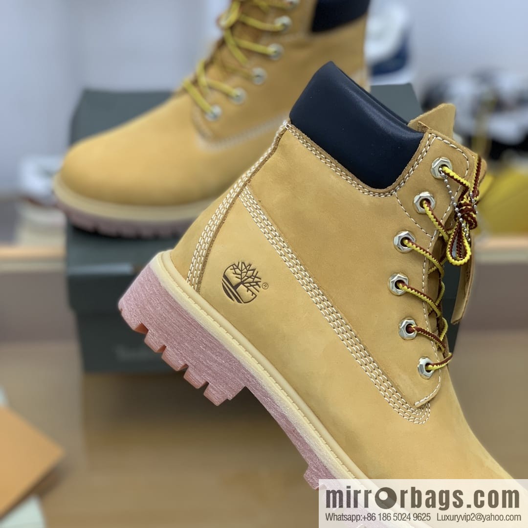Timberland's beige frosted leather with white stitching and side stamping His & Hers boots