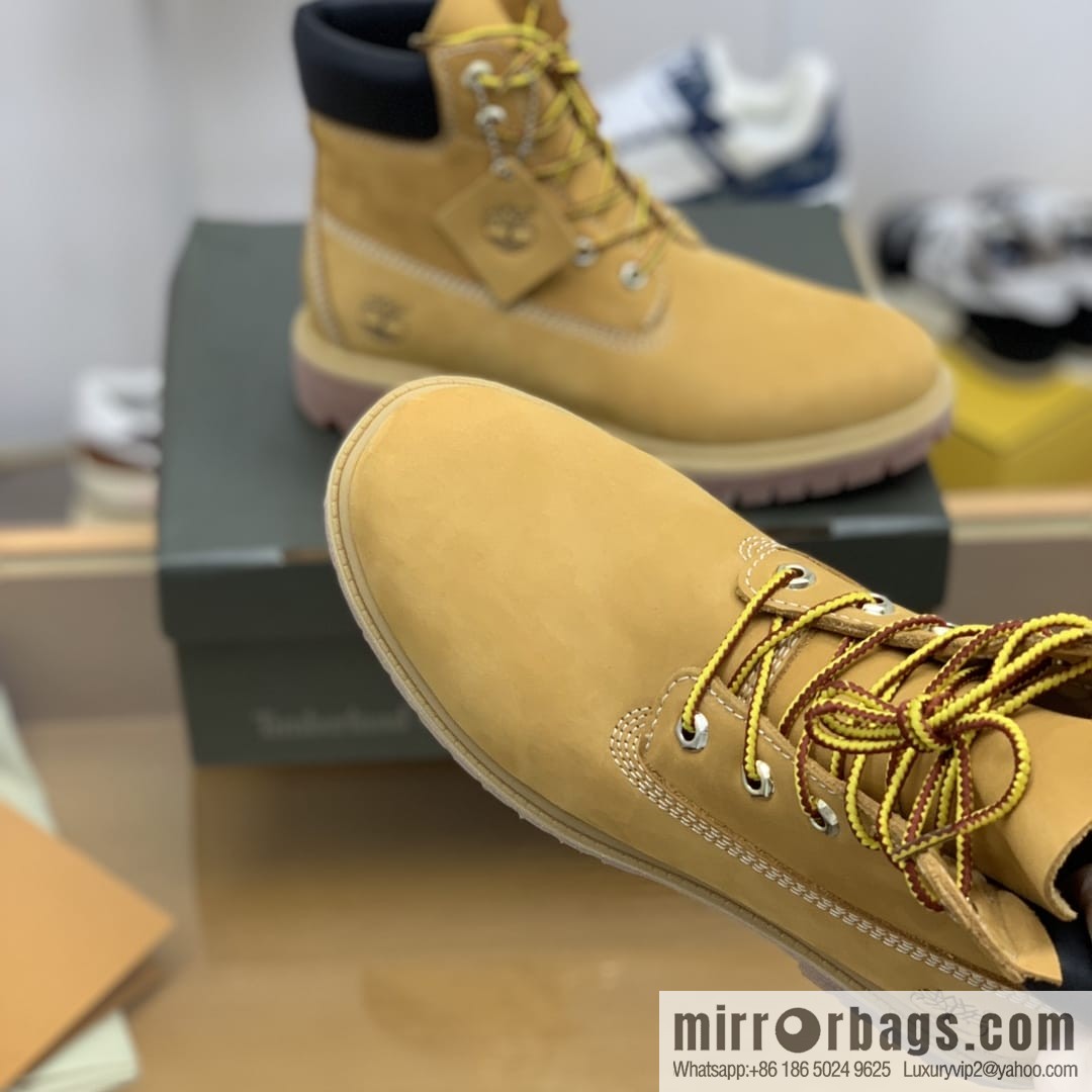Timberland's beige frosted leather with white stitching and side stamping His & Hers boots