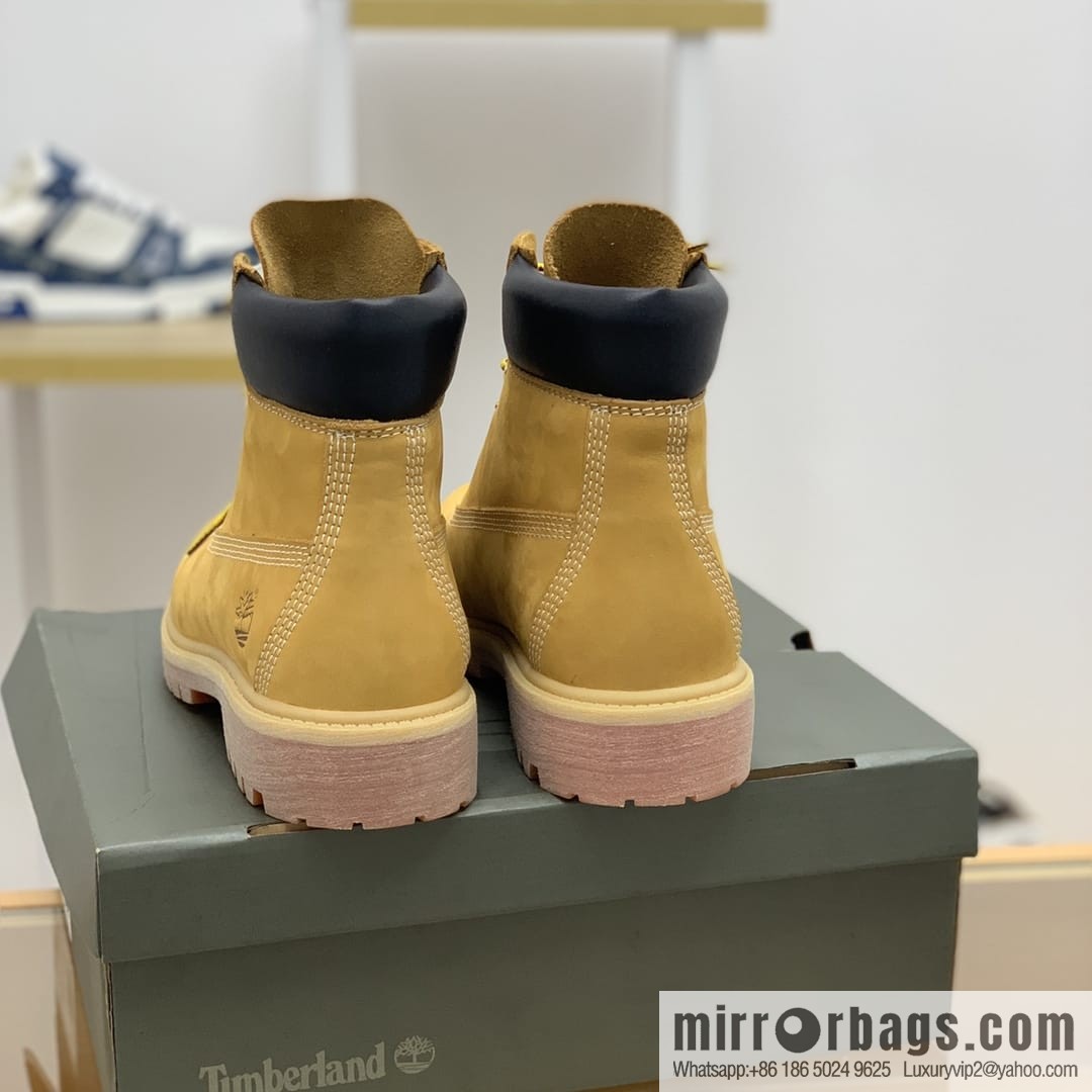 Timberland's beige frosted leather with white stitching and side stamping His & Hers boots