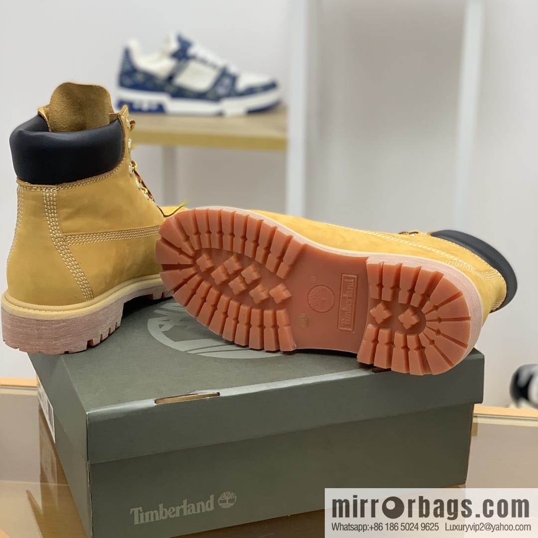 Timberland's beige frosted leather with white stitching and side stamping His & Hers boots