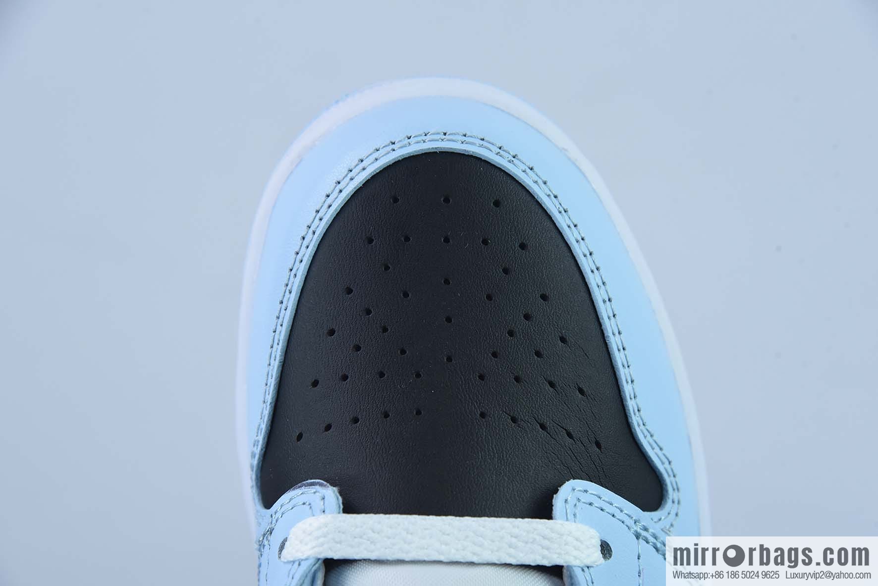 AJ1Mid Middle Gang, white, black and blue, item number 555112-401.