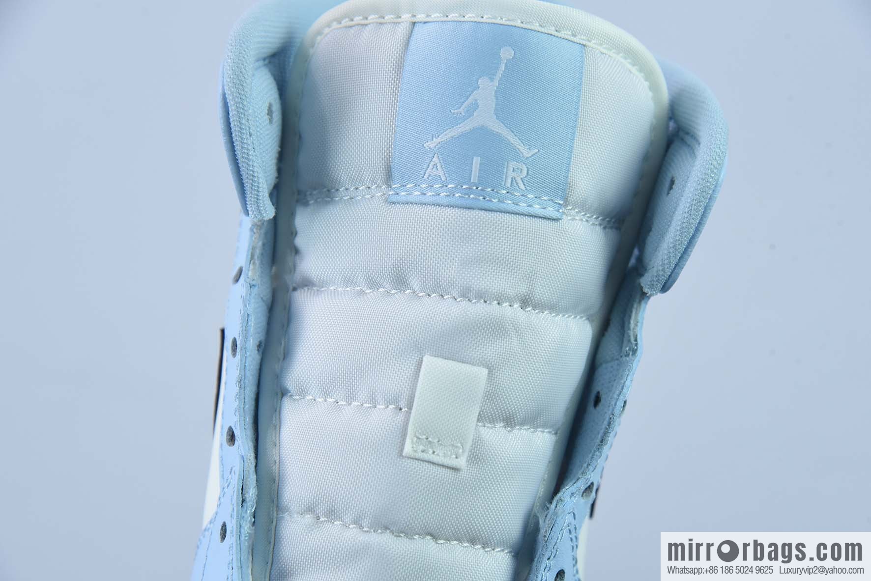 AJ1Mid Middle Gang, white, black and blue, item number 555112-401.