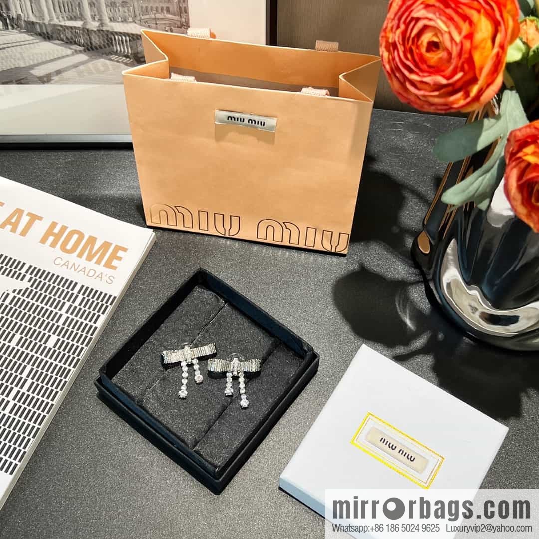 MIU MIU Miu Miu bow fringed stud earrings
