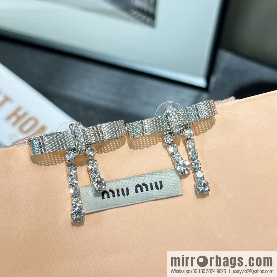 MIU MIU Miu Miu bow fringed stud earrings