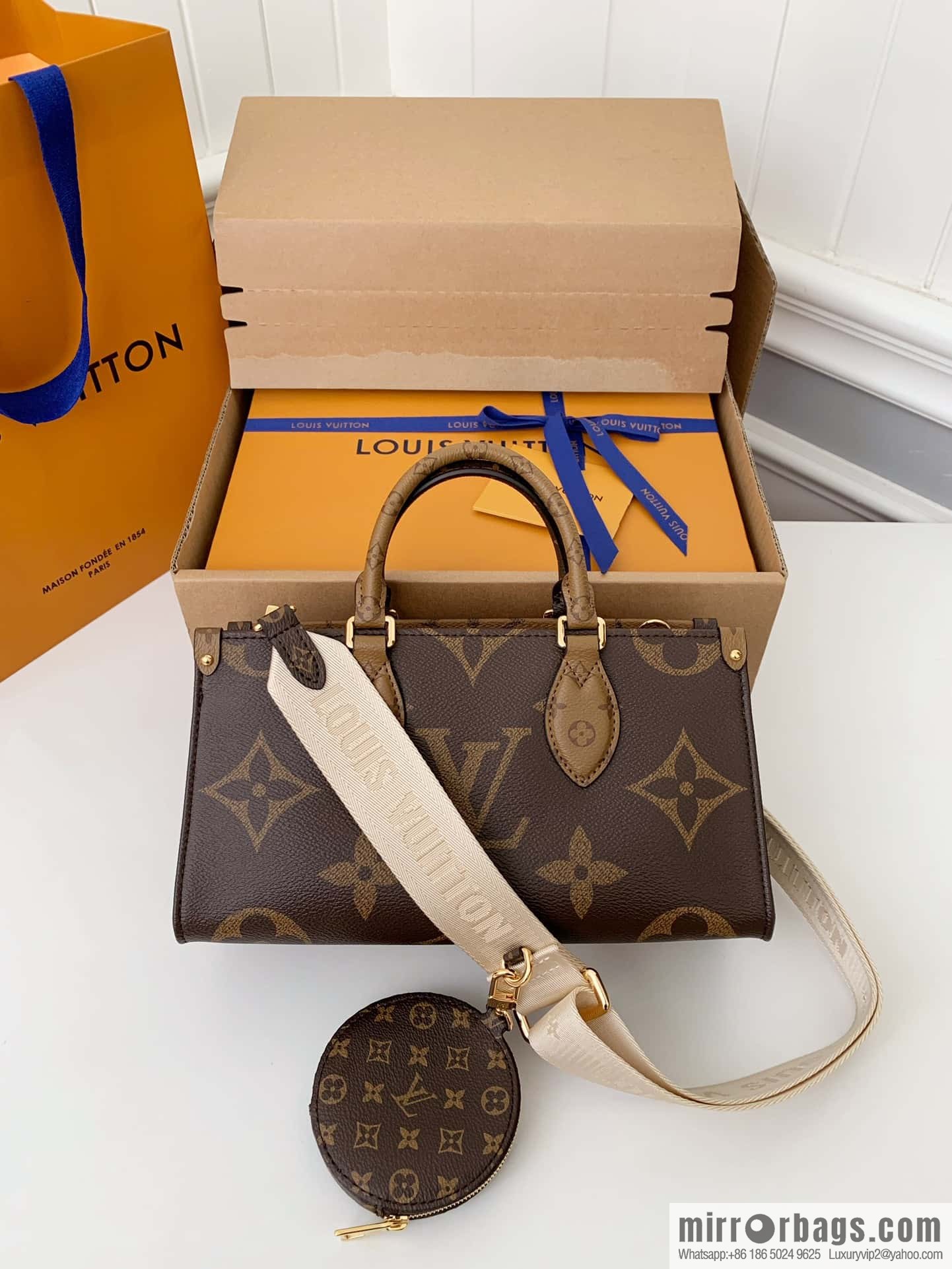 LV M46653 OnTheGo East West