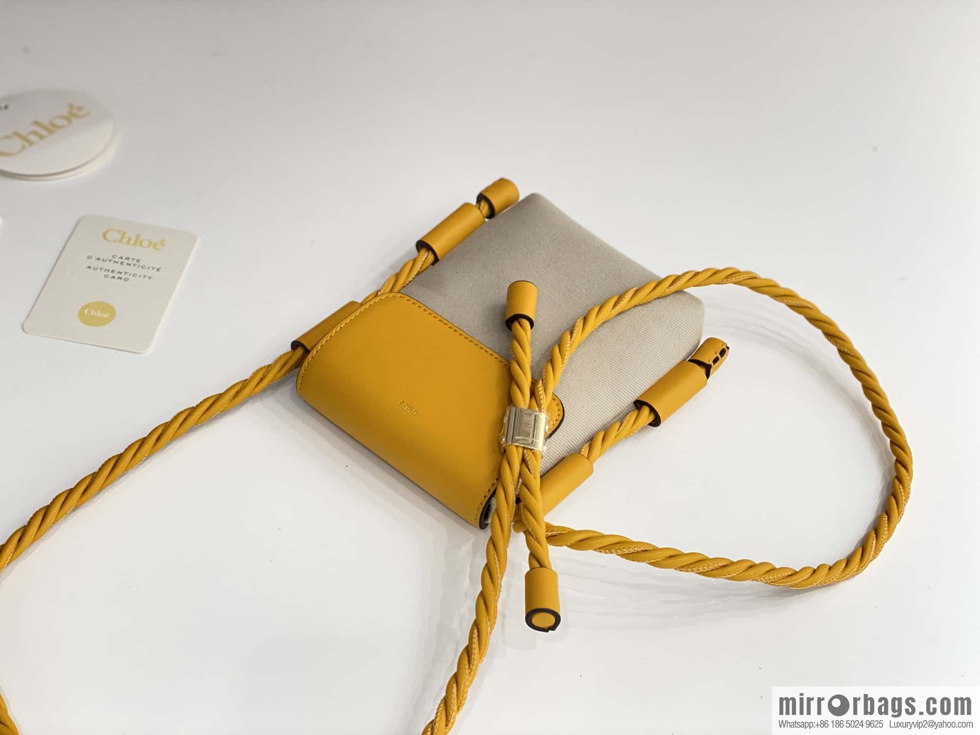 Chloe key X mobile phone bag, yellow cloth.