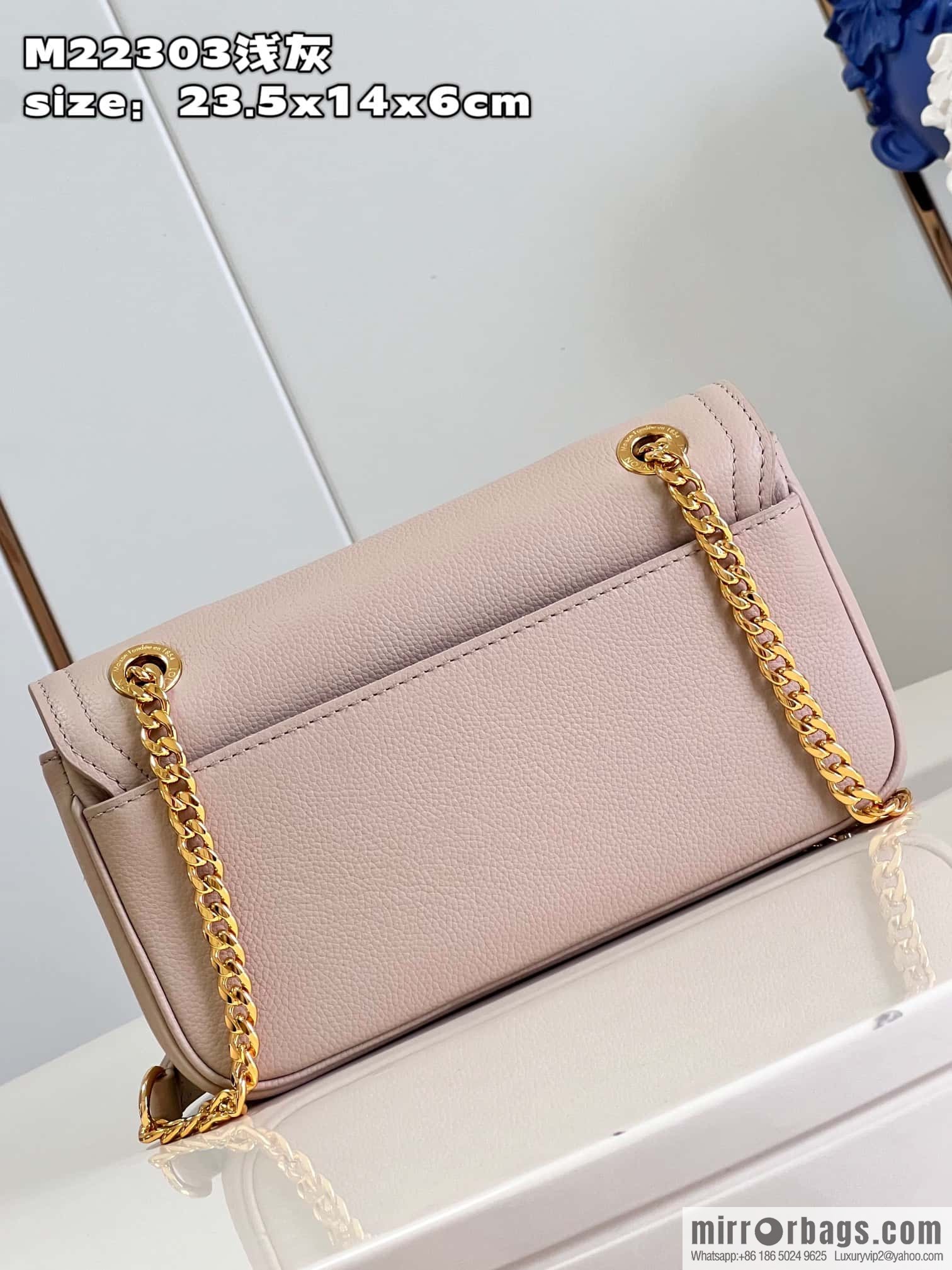 LV M22304 LOCKME EAST WEST chain bag