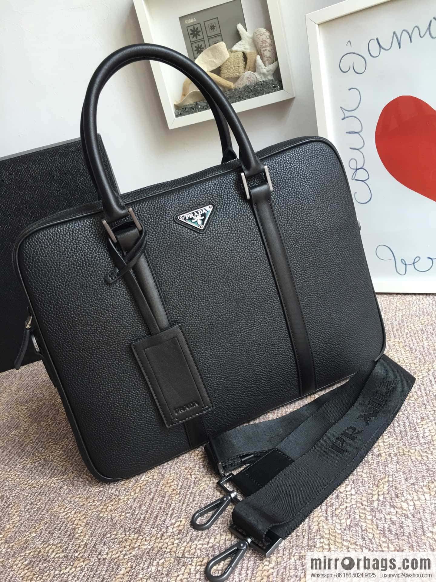 PRADA's latest broken leather briefcase 2VE368