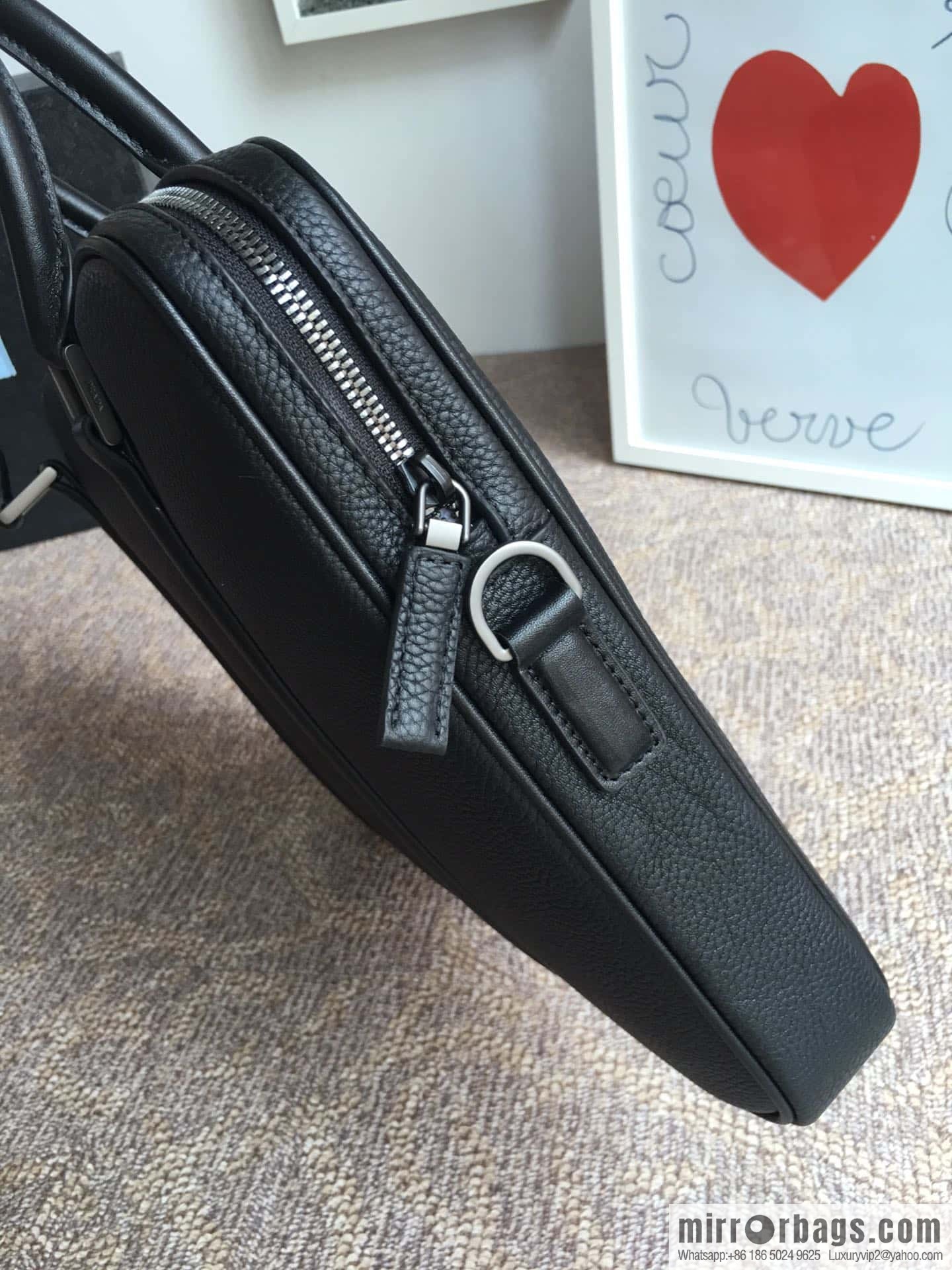 PRADA's latest broken leather briefcase 2VE368