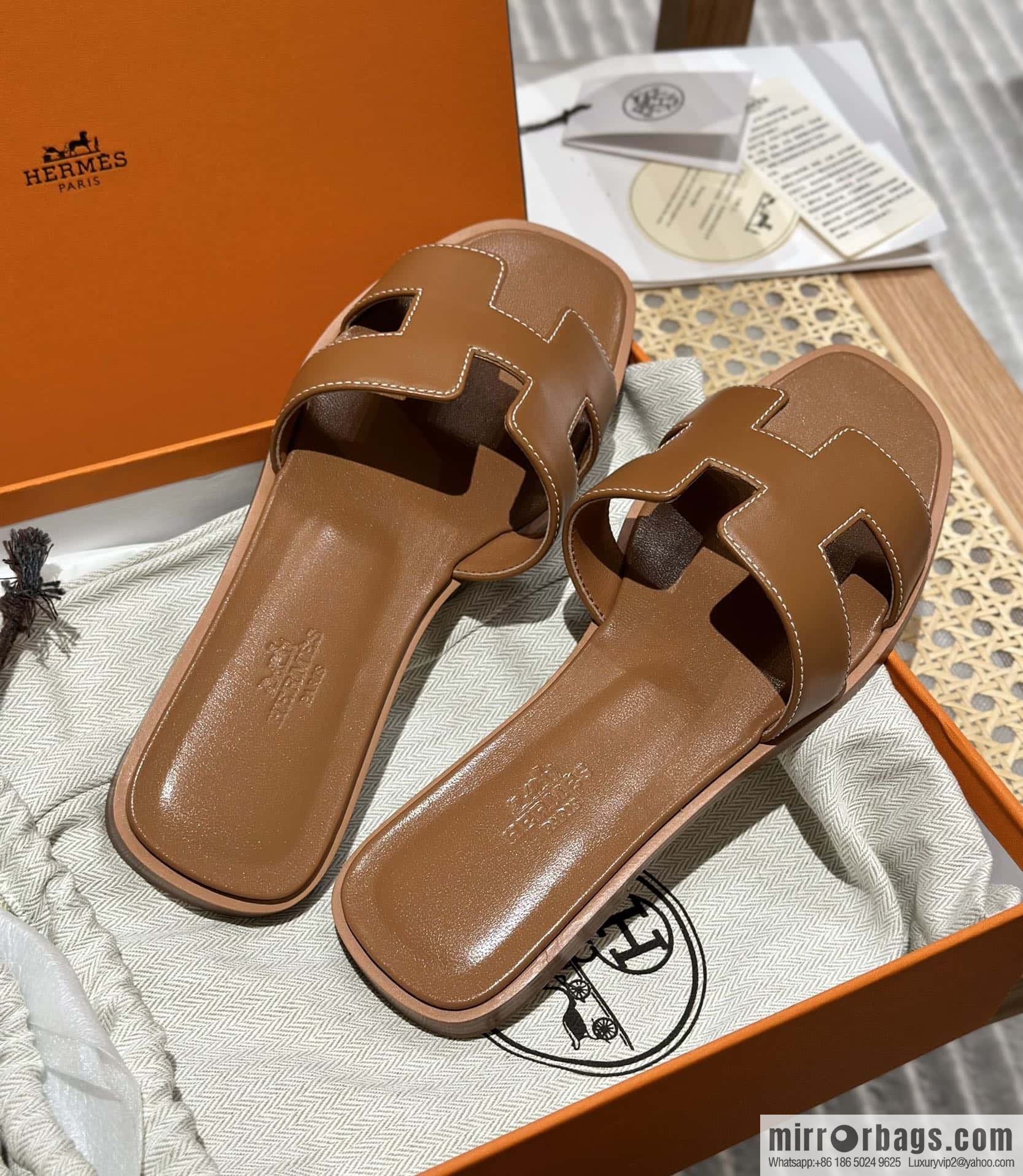 Hermès leather outsole H slippers, brown