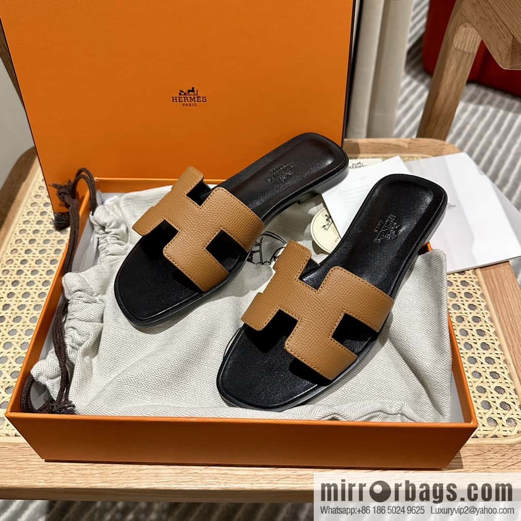 Hermès leather outsole H slippers, black and brown.